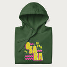 Folded forest green hoodie featuring a colorful 'OSAKA JAPAN' pop art design in bold pink and yellow, with abstract geometric shapes.