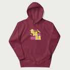 Maroon hoodie featuring a colorful 'OSAKA JAPAN' pop art design in bold pink and yellow, with abstract geometric shapes.