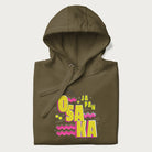 Folded military green hoodie featuring a colorful 'OSAKA JAPAN' pop art design in bold pink and yellow, with abstract geometric shapes.