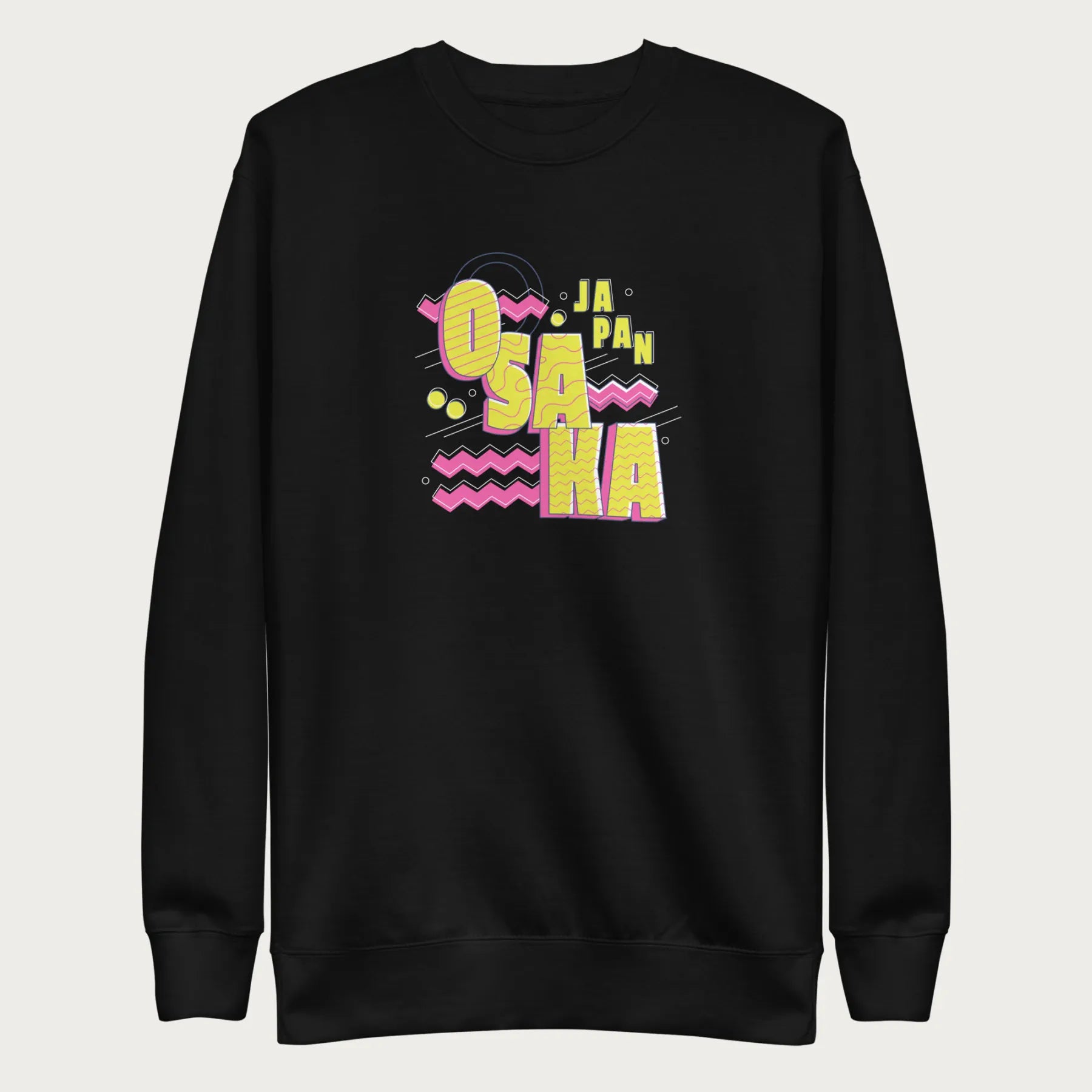 Black sweatshirt with a vibrant graphic of the words "OSAKA JAPAN" in large yellow letters, surrounded by pink zigzag lines.