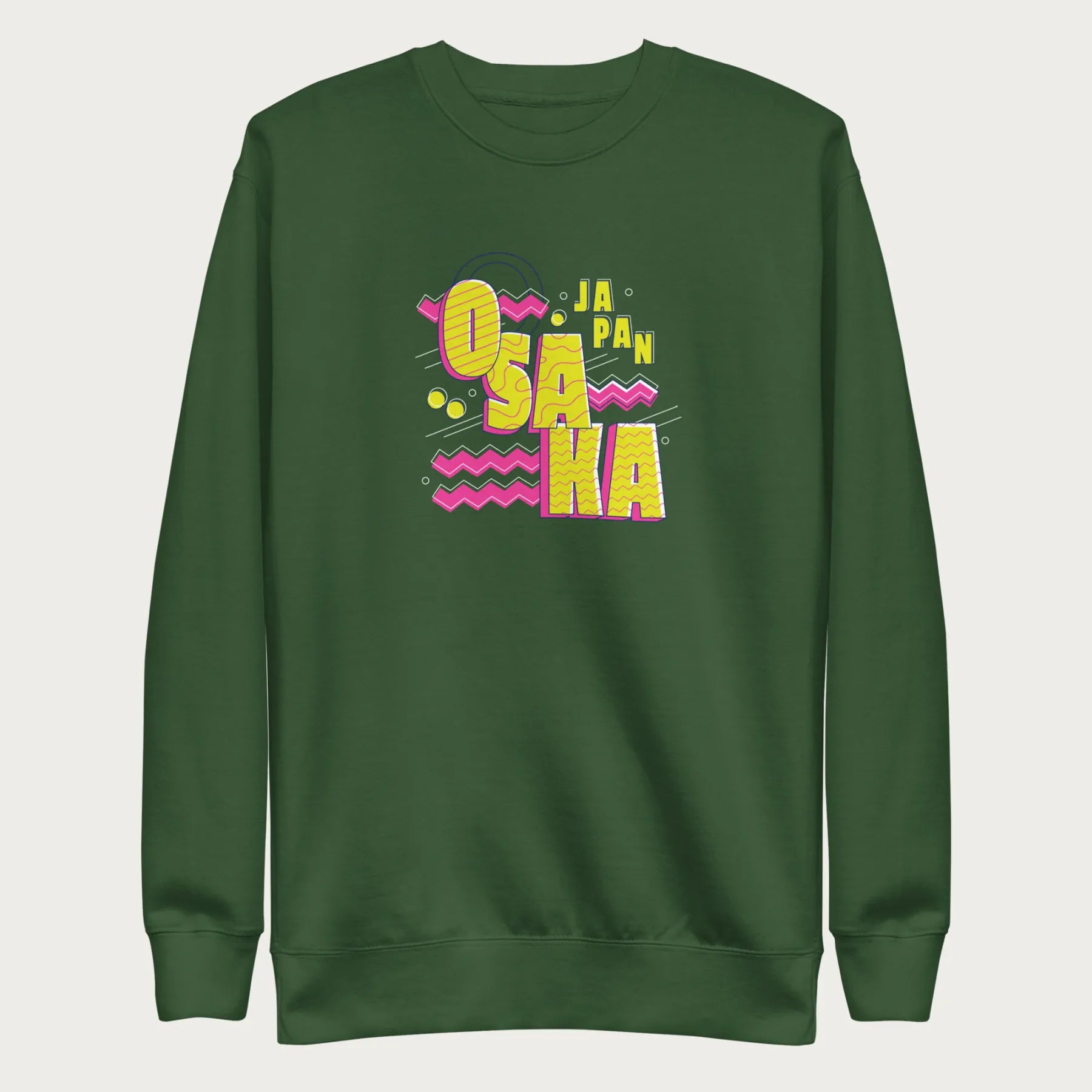 Forest green sweatshirt with a vibrant graphic of the words "OSAKA JAPAN" in large yellow letters, surrounded by pink zigzag lines.