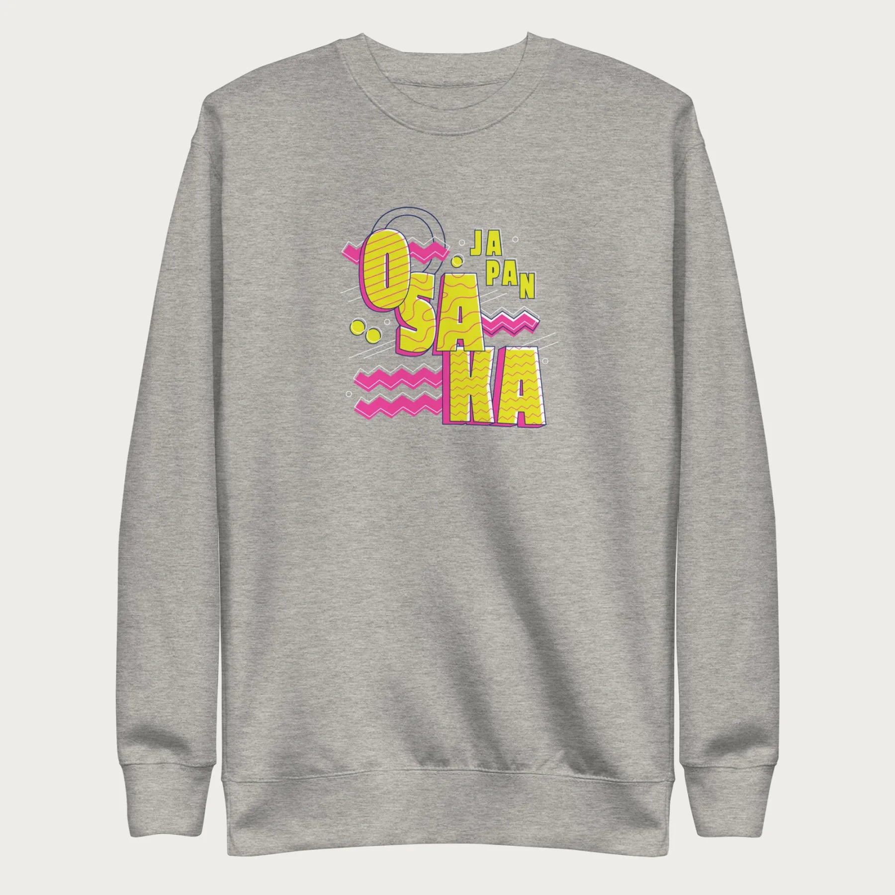 Light grey sweatshirt with a vibrant graphic of the words "OSAKA JAPAN" in large yellow letters, surrounded by pink zigzag lines.