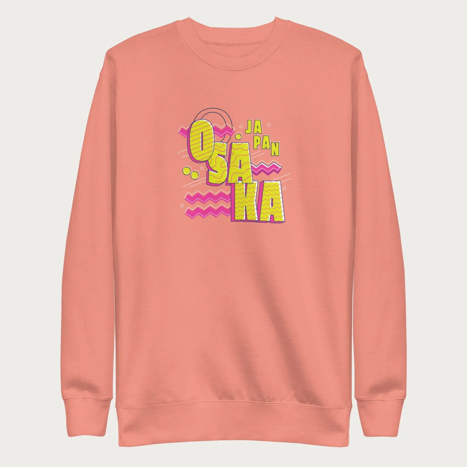 Light pink sweatshirt with a vibrant graphic of the words "OSAKA JAPAN" in large yellow letters, surrounded by pink zigzag lines.