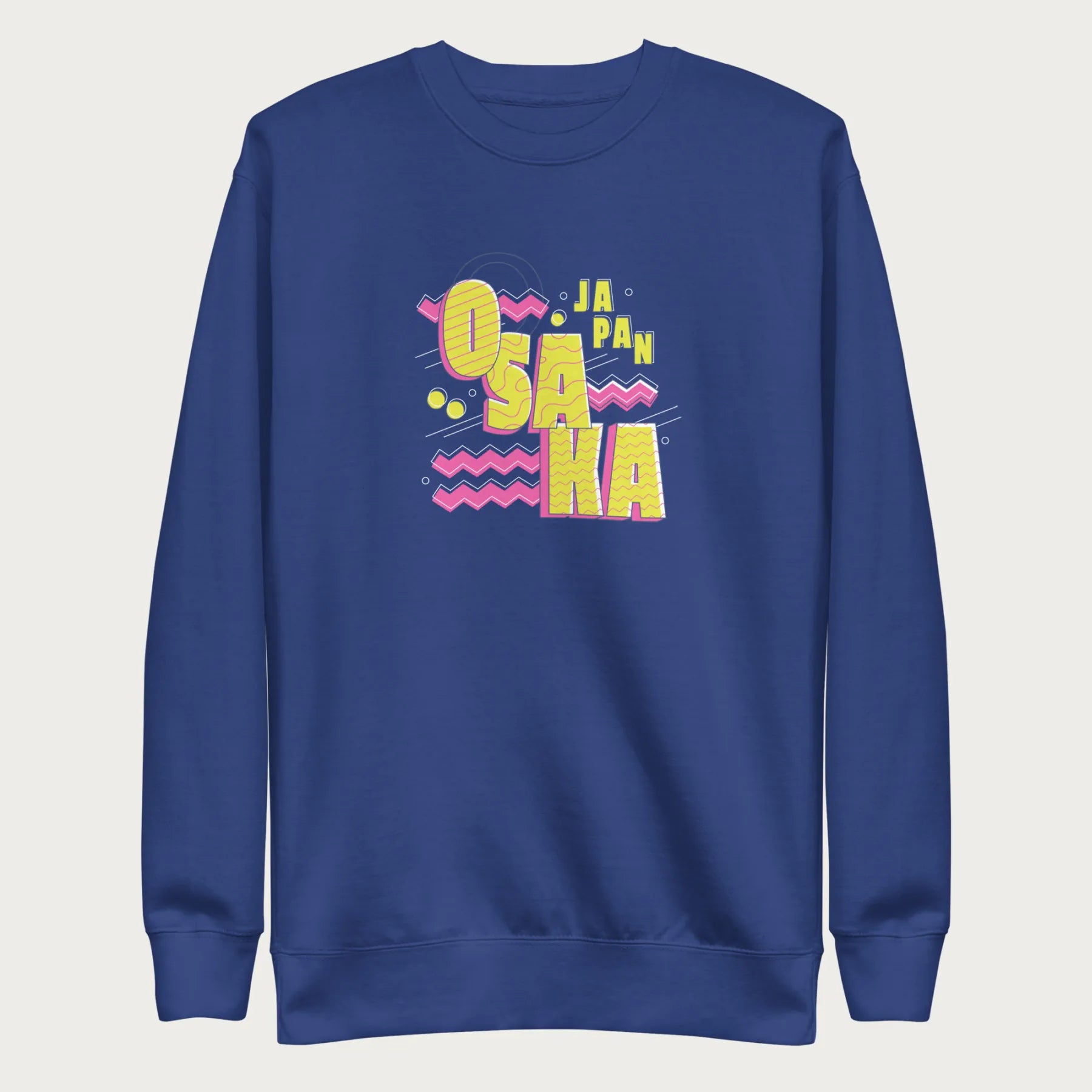 Royal blue sweatshirt with a vibrant graphic of the words "OSAKA JAPAN" in large yellow letters, surrounded by pink zigzag lines.