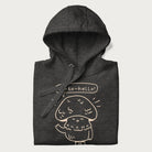 Folded dark grey hoodie with graphic of a cute mushroom waving and the text "Porto-hello!"