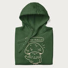 Folded forest green hoodie with graphic of a cute mushroom waving and the text "Porto-hello!"