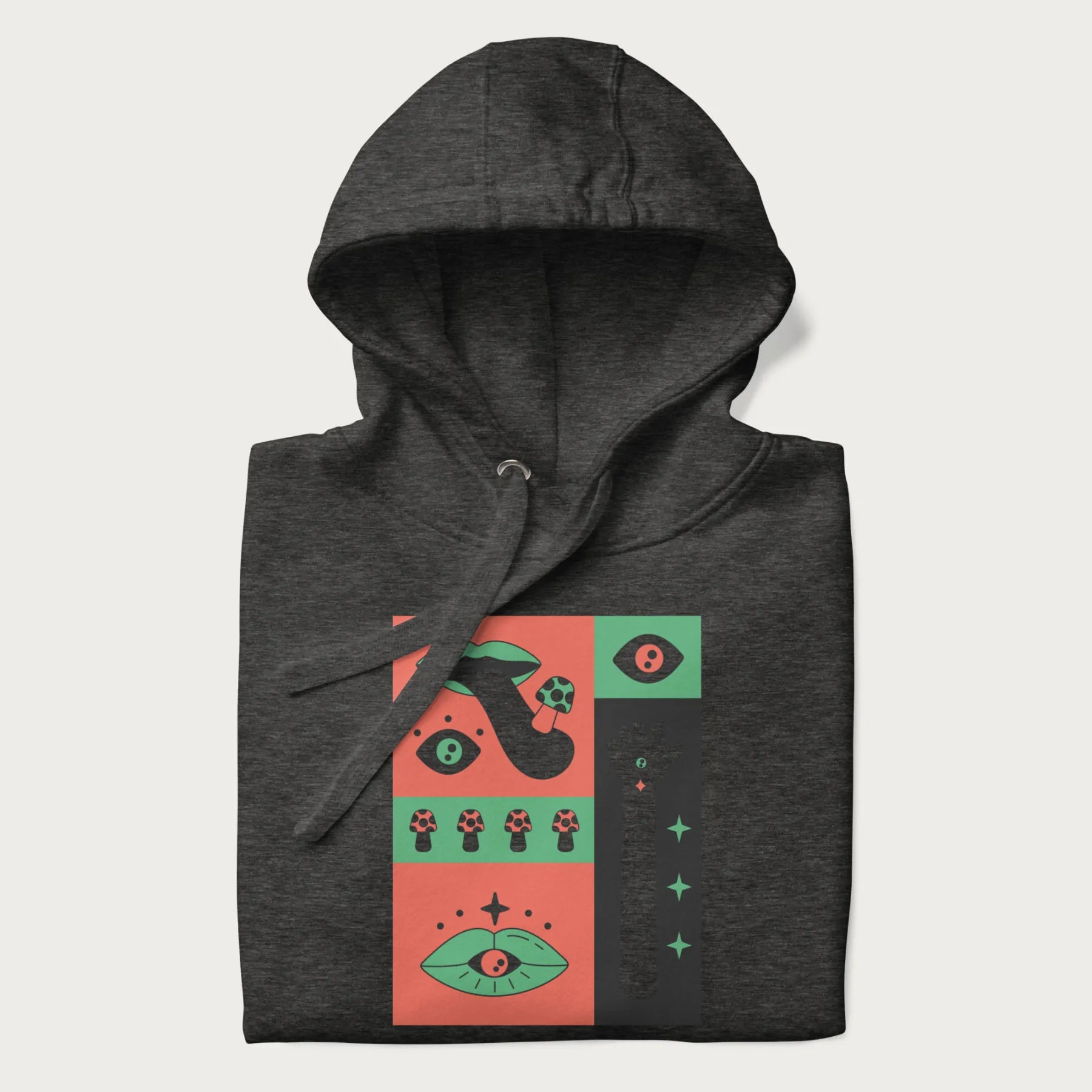 Folded dark grey hoodie with mushroom psychedelic designs of surreal elements like lips, eyes, and mushrooms.