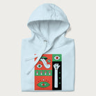 Folded light blue hoodie with mushroom psychedelic designs of surreal elements like lips, eyes, and mushrooms.