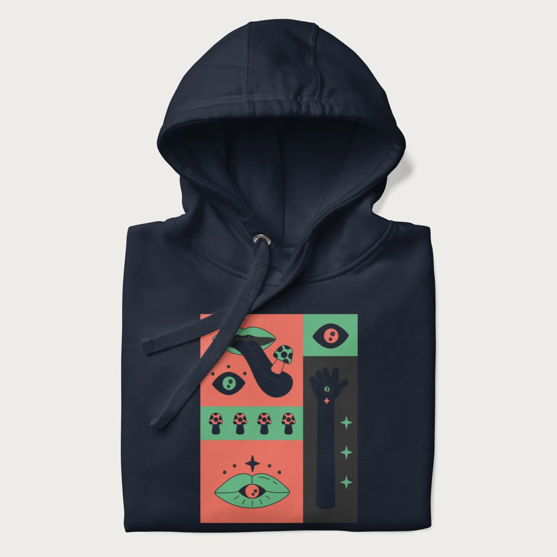Folded navy blue hoodie with mushroom psychedelic designs of surreal elements like lips, eyes, and mushrooms.