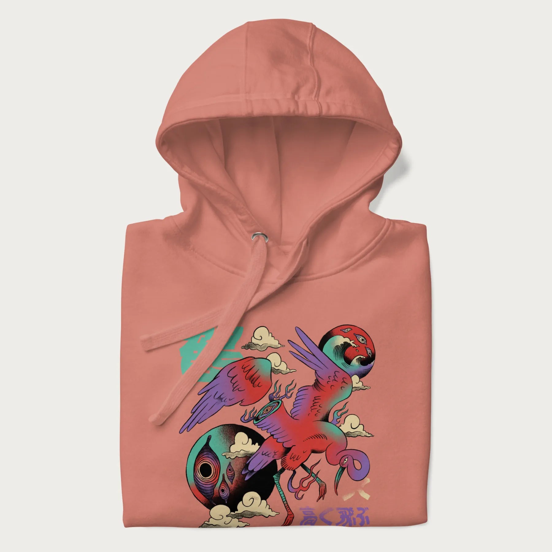 Folded light pink hoodie with Japanese crane graphic in vibrant colors and Japanese text '鶴' (Crane) and '高く飛ぶ' (Fly High).