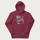 Maroon hoodie with Japanese crane graphic in vibrant colors and Japanese text '鶴' (Crane) and '高く飛ぶ' (Fly High).