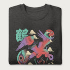 Folded dark grey sweatshirt with a vibrant psychedelic Japanese crane graphic and Japanese text.