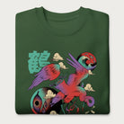 Folded forest green sweatshirt with a vibrant psychedelic Japanese crane graphic and Japanese text.