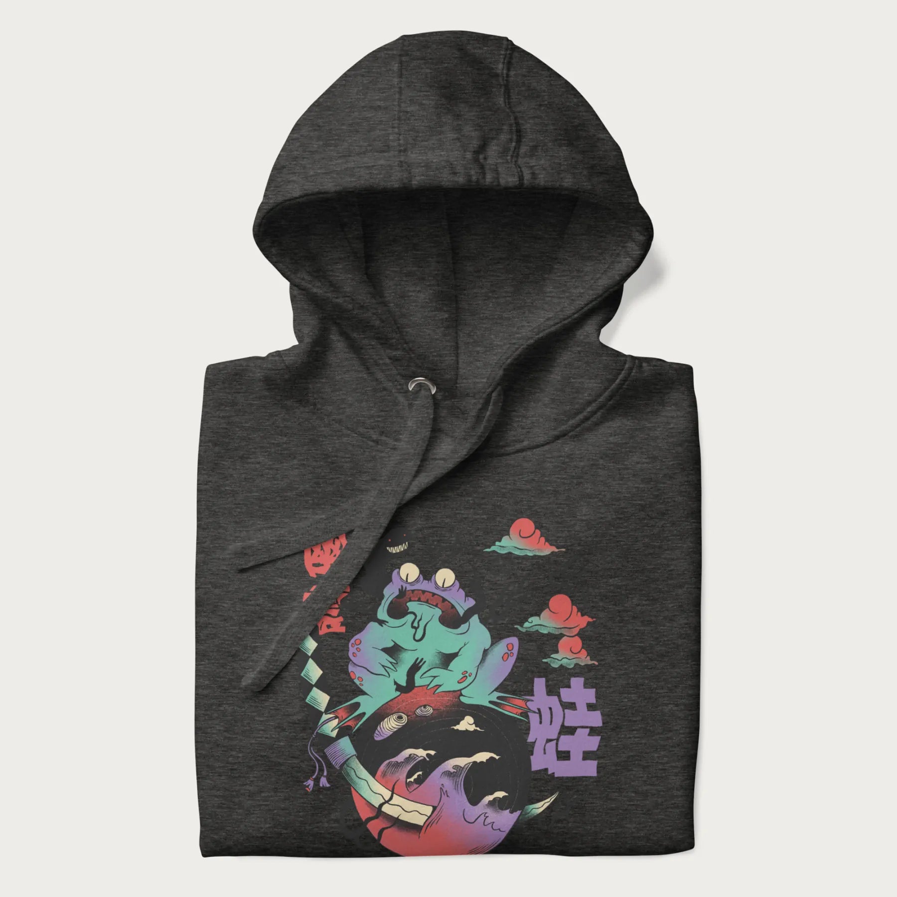 Folded dark grey hoodie with Japanese psychedelic graphic of a frog with text '蛙' (Frog) and '幽靈' (Ghost) in Japanese characters.