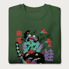 Folded forest green sweatshirt with a psychedelic Japanese frog graphic in vibrant colors with Japanese text.