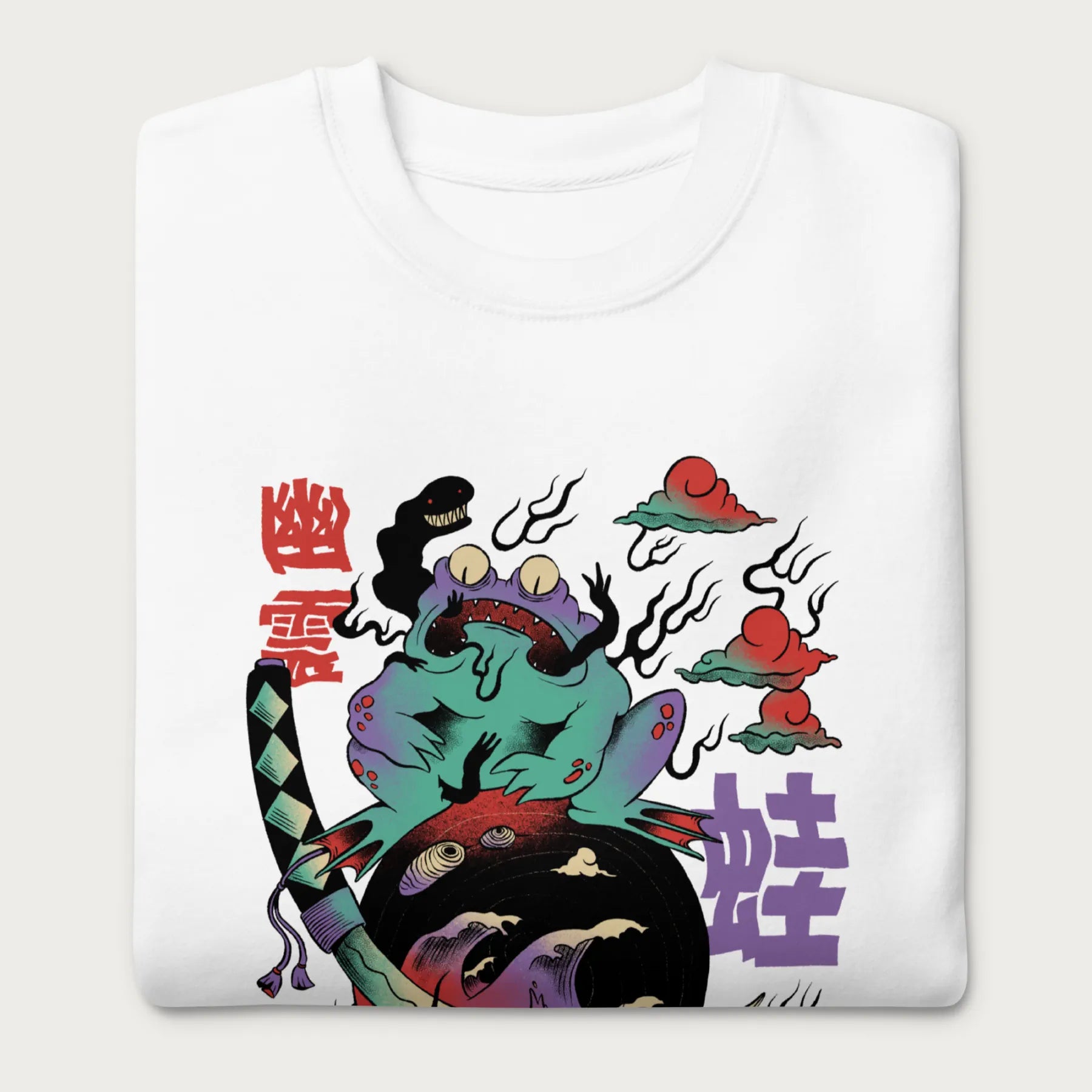 Folded white sweatshirt with a psychedelic Japanese frog graphic in vibrant colors with Japanese text.