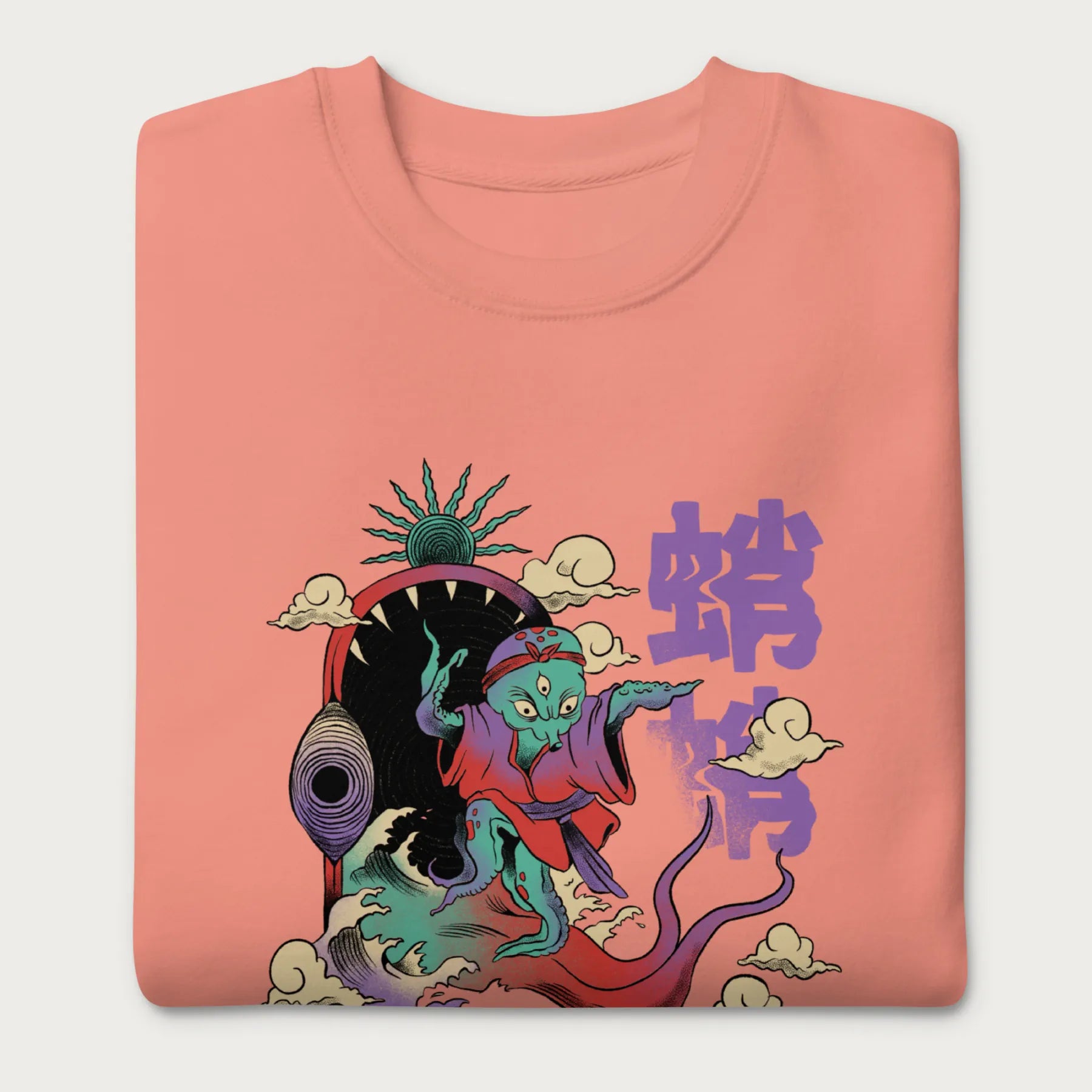 Folded light pink sweatshirt with a vibrant psychedelic Japanese octopus graphic with Japanese text.