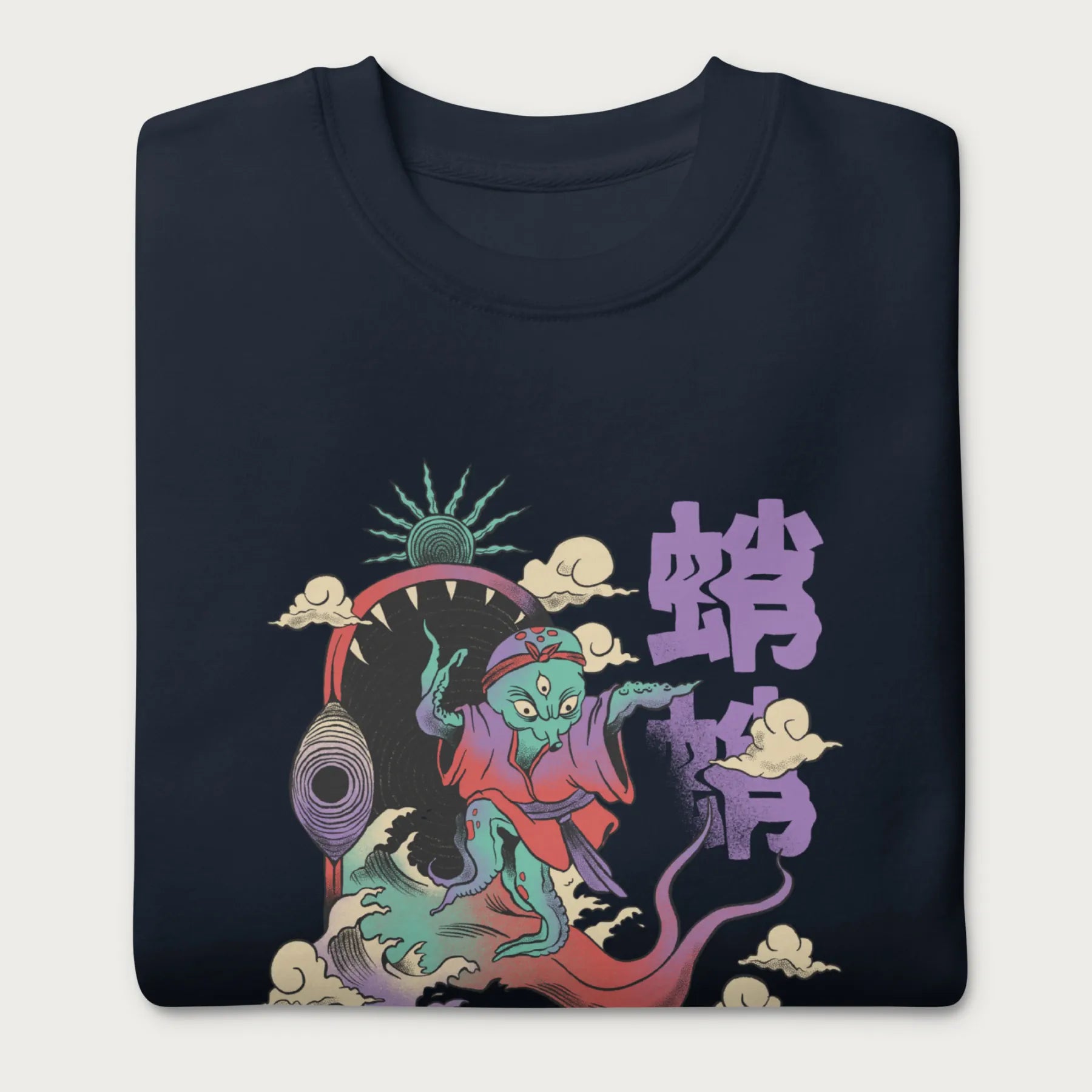 Folded navy blue sweatshirt with a vibrant psychedelic Japanese octopus graphic with Japanese text.