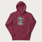 Maroon hoodie with Japanese psychedelic snake graphic, with Japanese text 'ヘビ' (Snake) and 'トリッピー' (Trippy) in vibrant colors.