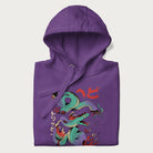 Folded purple hoodie with Japanese psychedelic snake graphic, with Japanese text 'ヘビ' (Snake) and 'トリッピー' (Trippy) in vibrant colors.