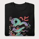 Folded black sweatshirt with a vibrant psychedelic Japanese snake graphic with Japanese text.