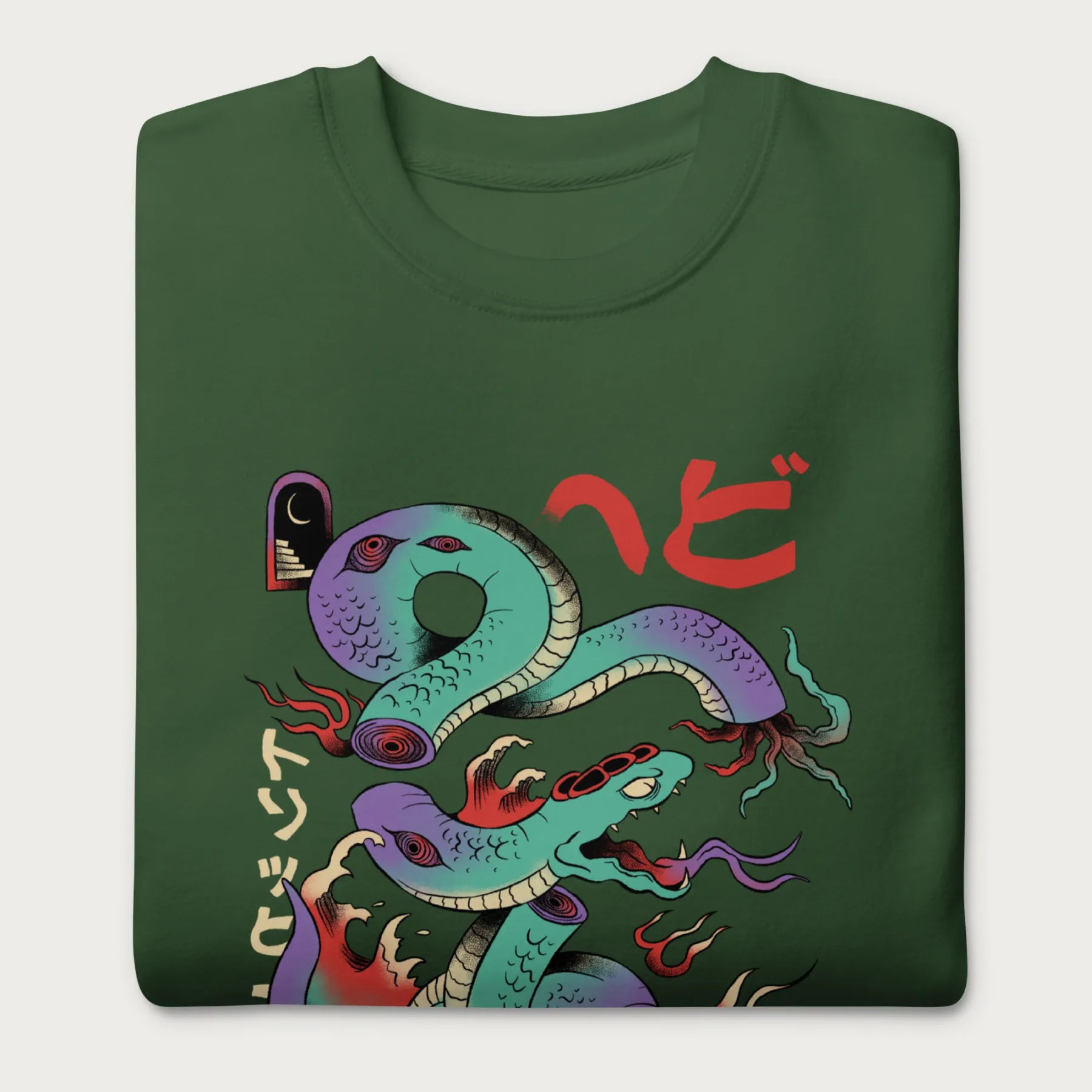 Folded forest green sweatshirt with a vibrant psychedelic Japanese snake graphic with Japanese text.