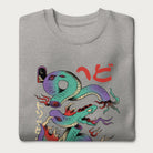 Folded light grey sweatshirt with a vibrant psychedelic Japanese snake graphic with Japanese text.