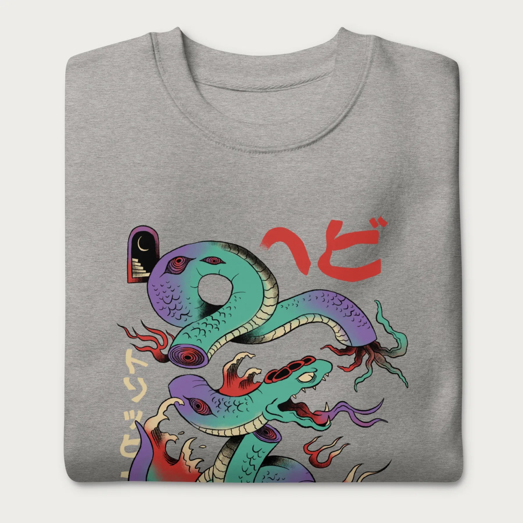 Folded light grey sweatshirt with a vibrant psychedelic Japanese snake graphic with Japanese text.