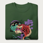 Folded forest green sweatshirt with a psychedelic Japanese tiger graphic featuring vibrant colors and bold details, including Japanese characters.