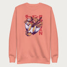 Light pink sweatshirt with a vibrant graphic of a bowl of ramen noodles, depicted in a dynamic, cartoonish style with bold Japanese text.