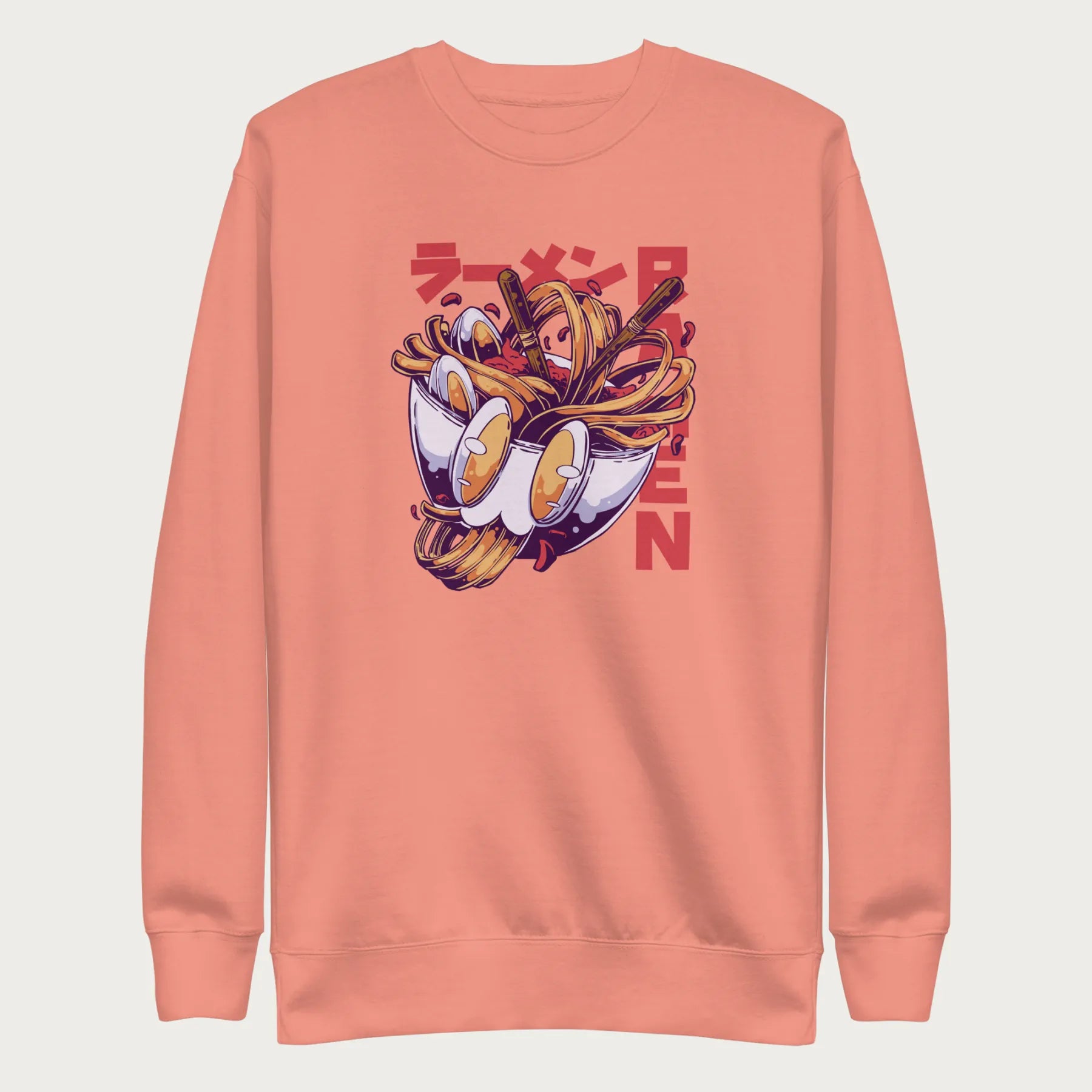 Light pink sweatshirt with a vibrant graphic of a bowl of ramen noodles, depicted in a dynamic, cartoonish style with bold Japanese text.