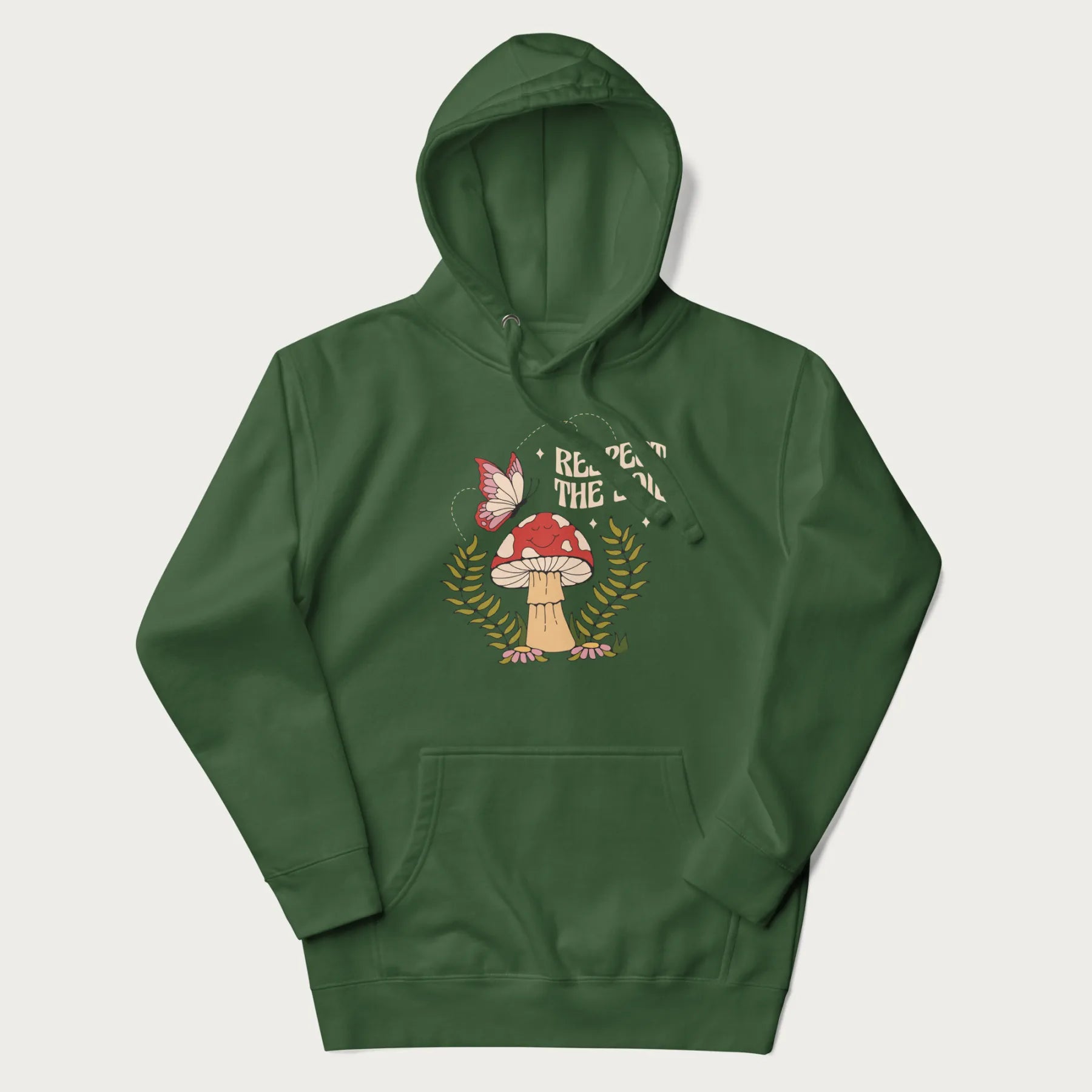 Forest green hoodie with mushroom and butterfly design, with the text 'Respect the Soil' above it. 