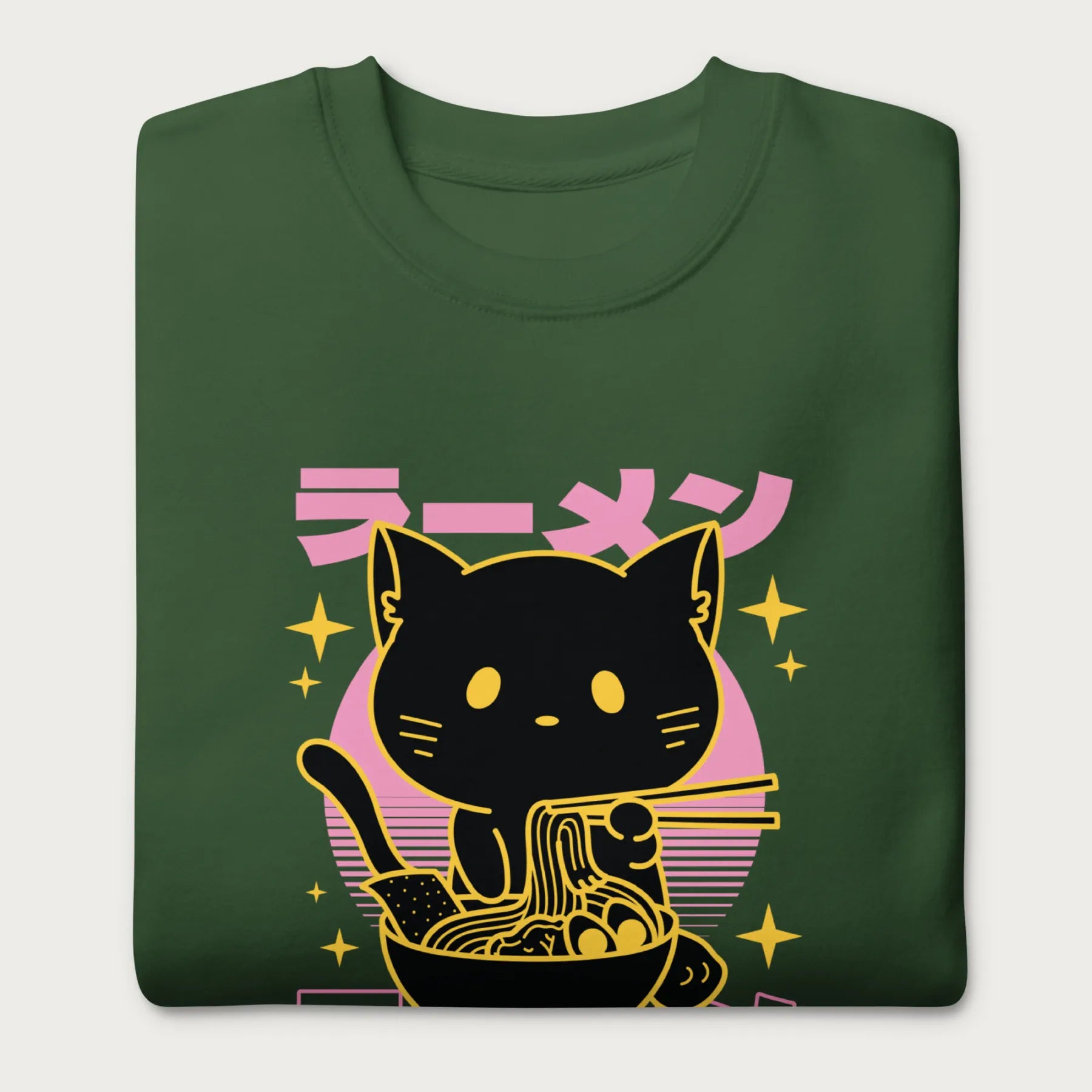 Folded forest green sweatshirt with Japanese text and a neon outline graphic of a cat eating ramen.