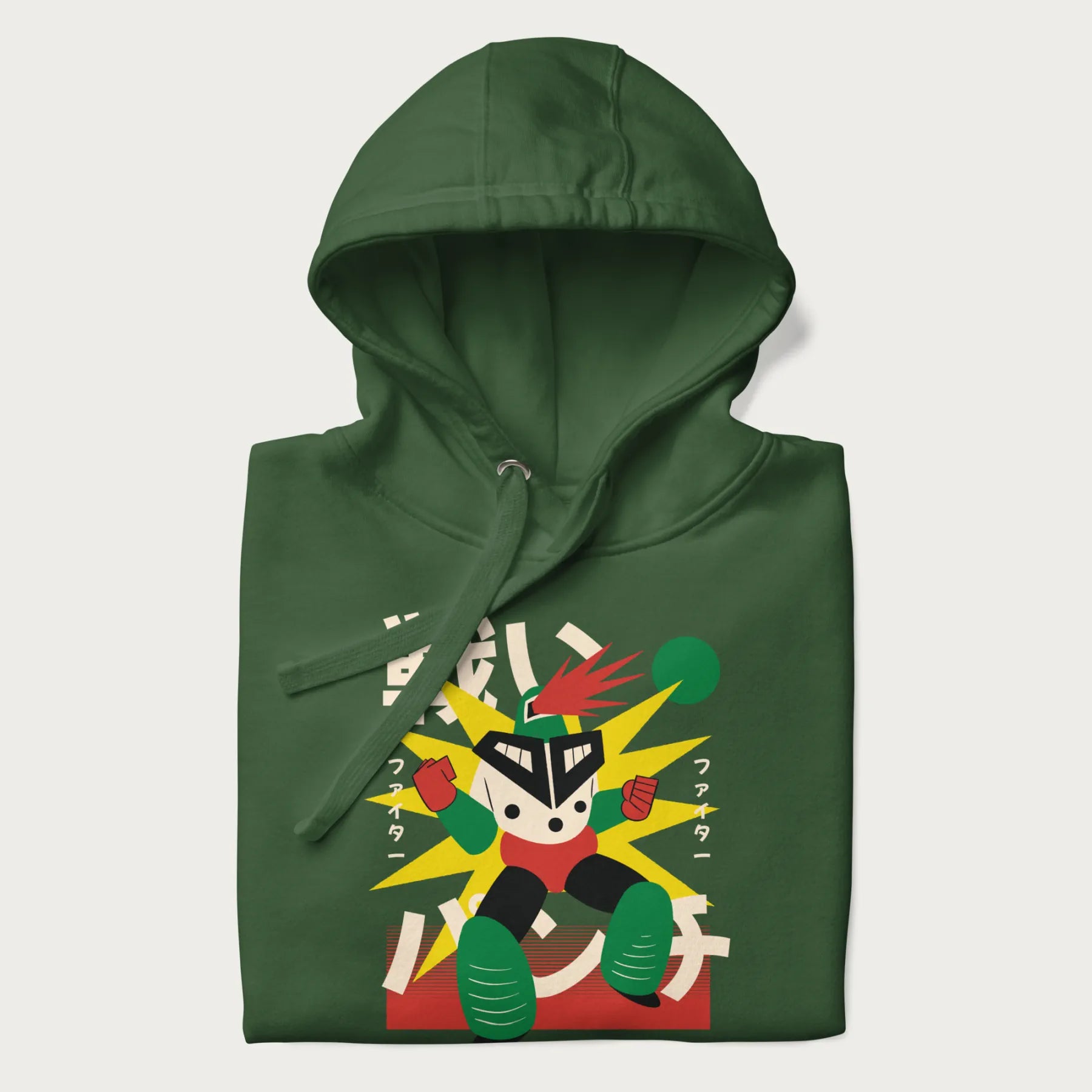 Folded forest green hoodie with Japanese text and a retro-futuristic robot fighter graphic.