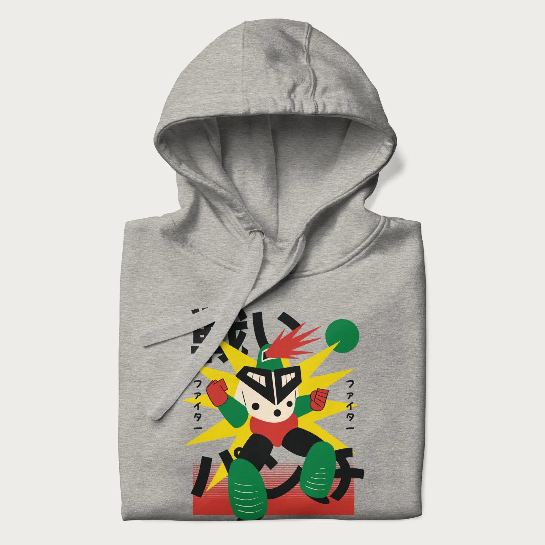 Folded light grey hoodie with Japanese text and a retro-futuristic robot fighter graphic.