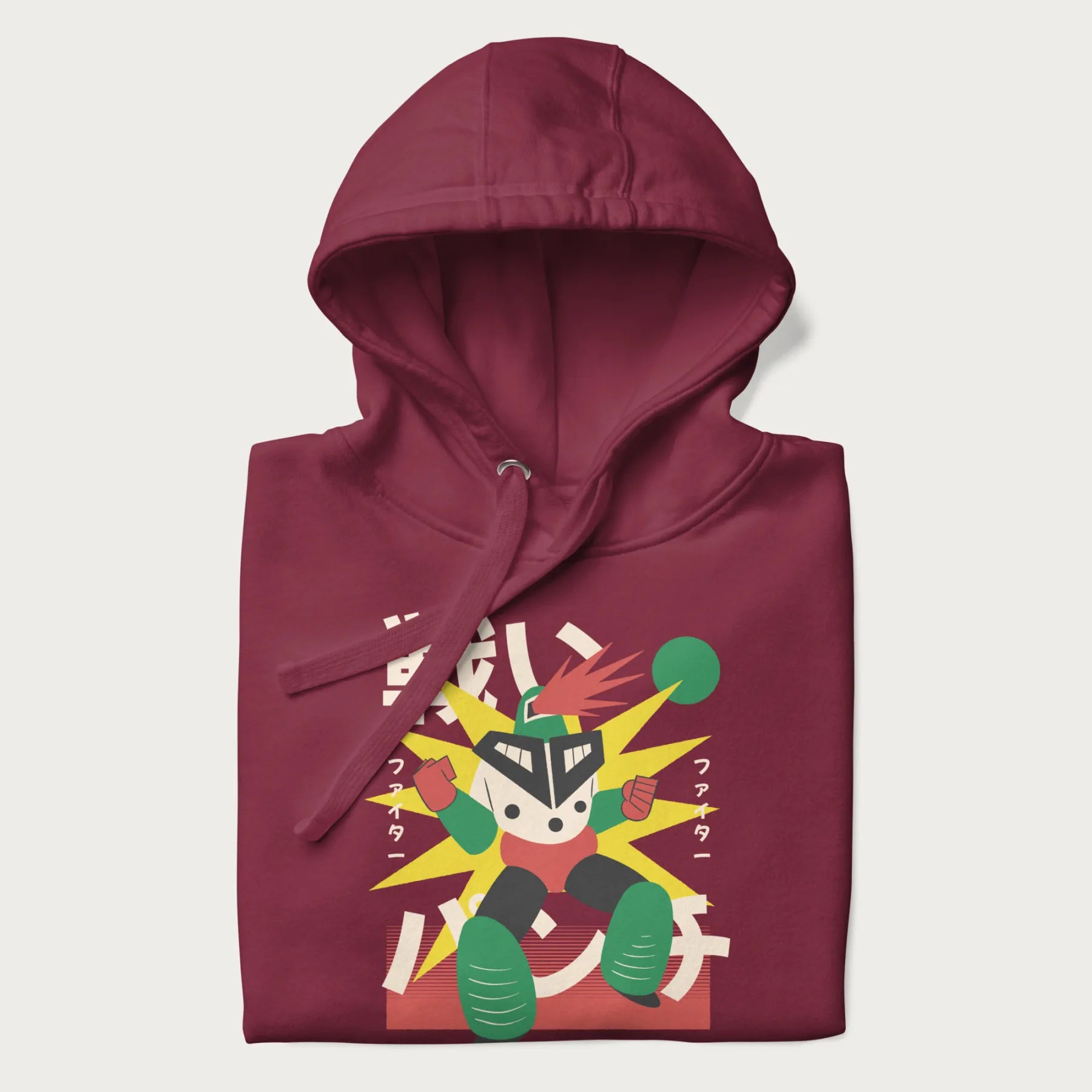 Folded maroon hoodie with Japanese text and a retro-futuristic robot fighter graphic.