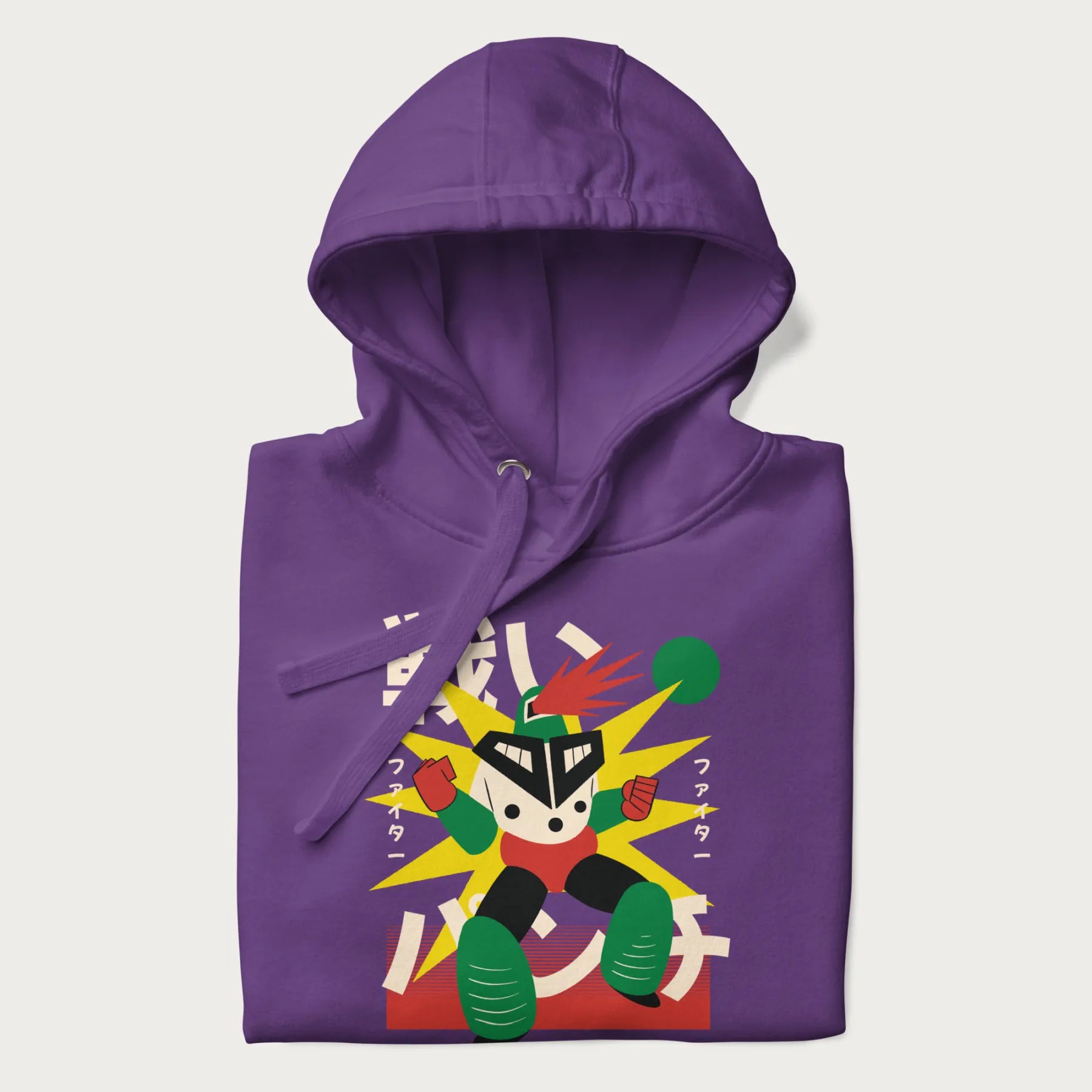 Folded purple hoodie with Japanese text and a retro-futuristic robot fighter graphic.