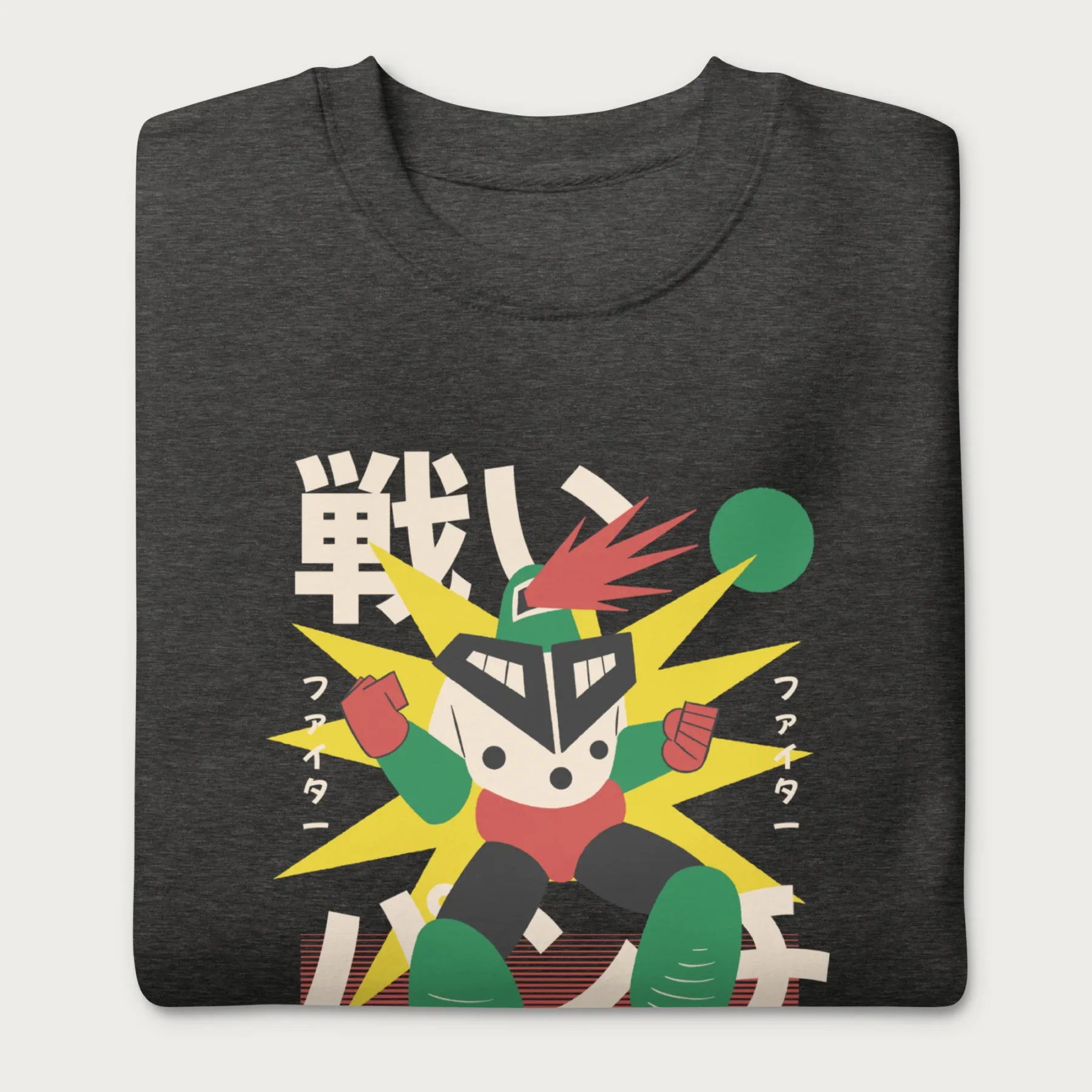 Folded dark grey sweatshirt with Japanese text and a retro-styled robot graphic.