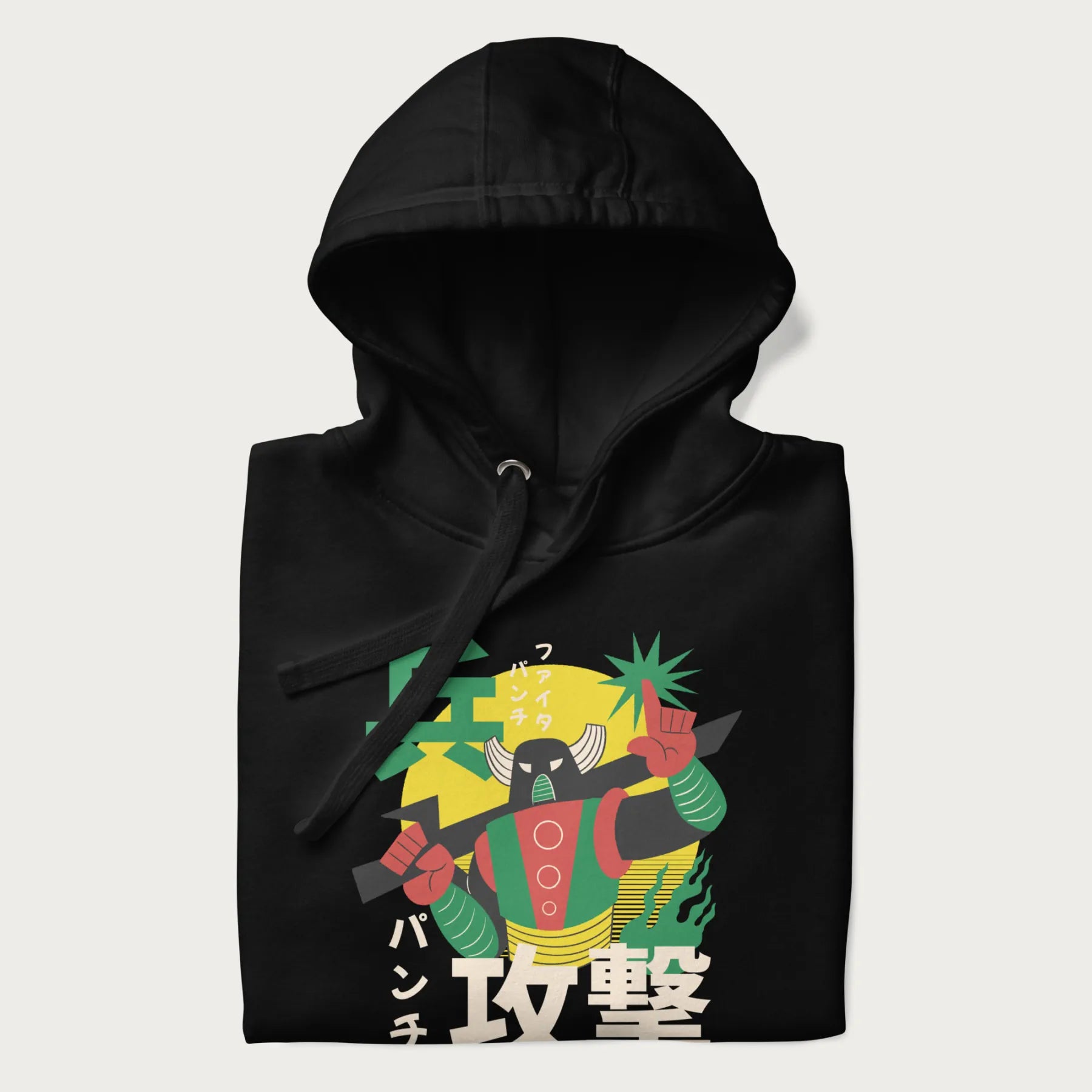 Folded black hoodie with Japanese text and a retro graphic of a robot warrior holding a sword.