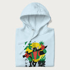 Folded light blue hoodie with Japanese text and a retro graphic of a robot warrior holding a sword.