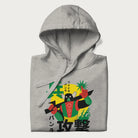 Folded light grey hoodie with Japanese text and a retro graphic of a robot warrior holding a sword.