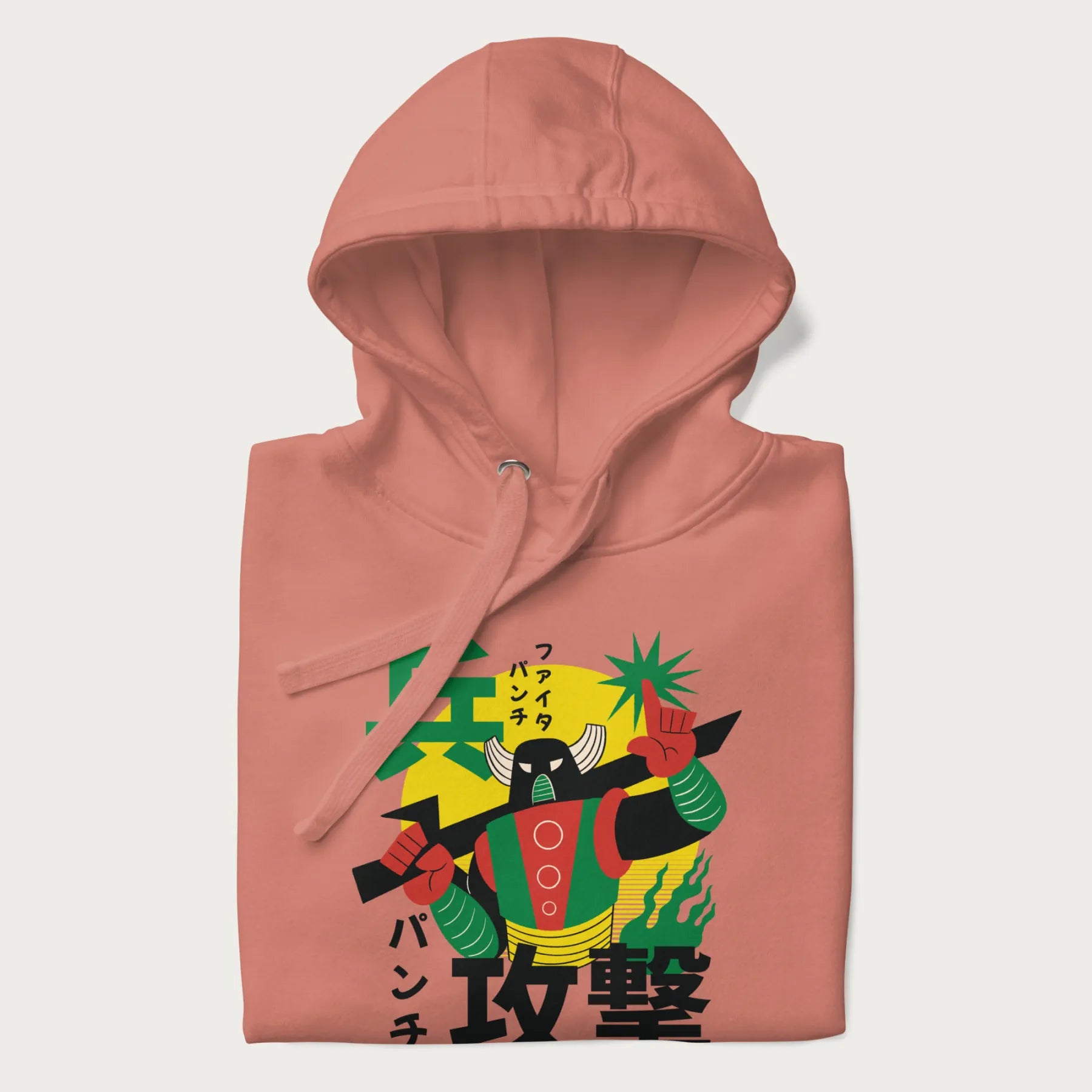 Folded light pink hoodie with Japanese text and a retro graphic of a robot warrior holding a sword.