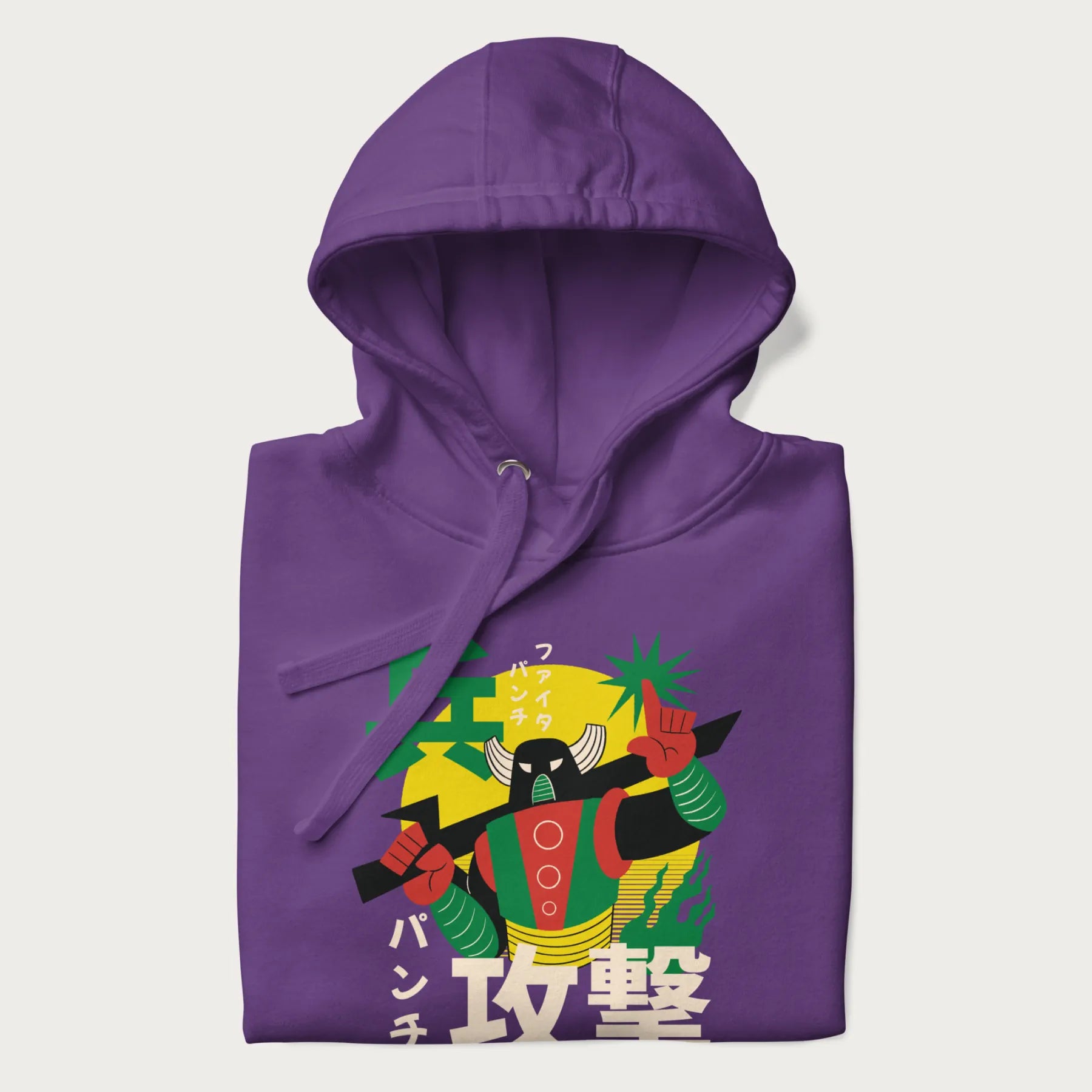 Folded purple hoodie with Japanese text and a retro graphic of a robot warrior holding a sword.