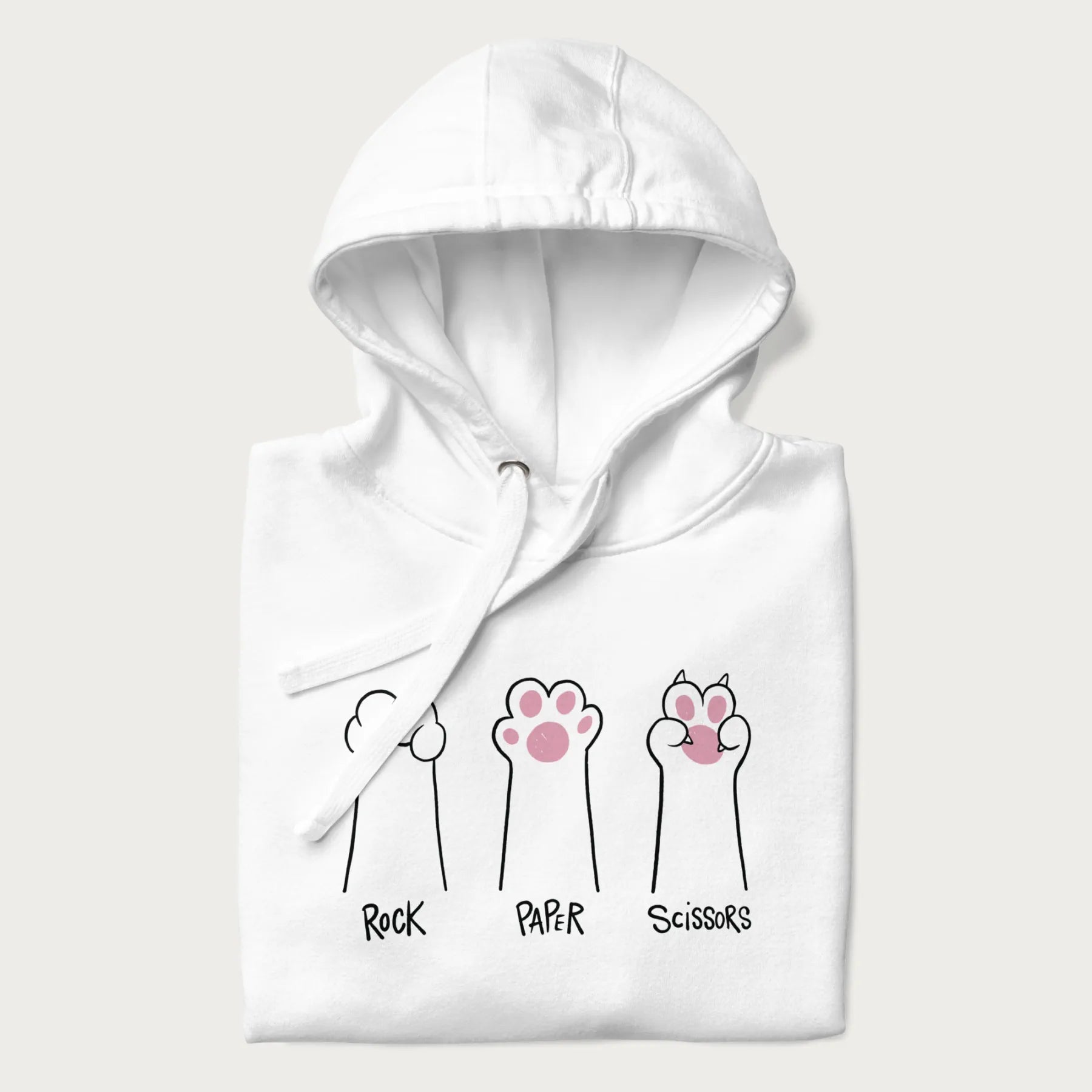 Folded white hoodie with graphic of cat paws playing rock-paper-scissors.