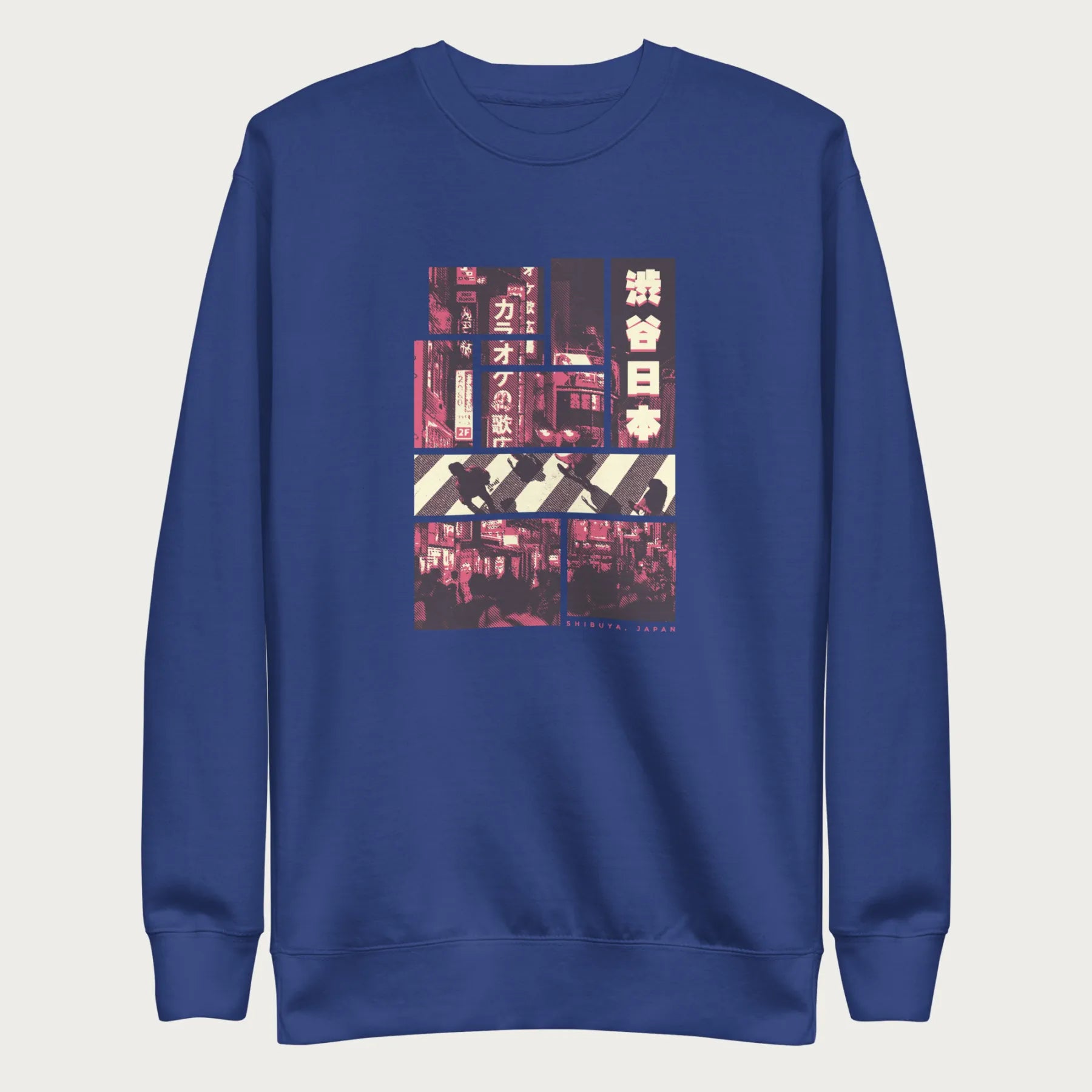 Royal blue sweatshirt with a graphic panels of Shibuya's nightlife, featuring the iconic crosswalk, neon signs, and Japanese text.