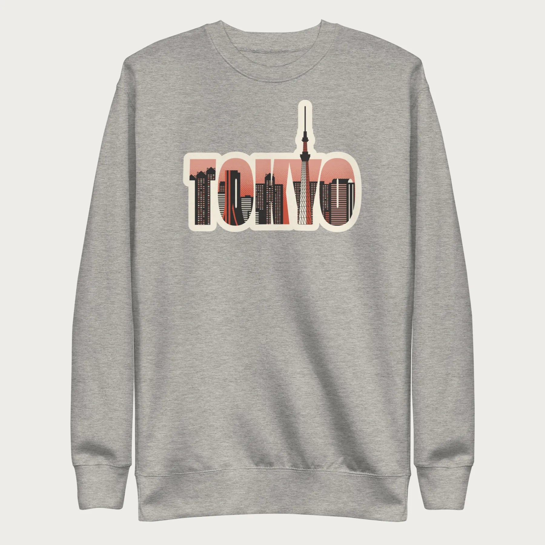 Folded light grey sweatshirt with a graphic of Tokyo's skyline integrated within the letters spelling "TOKYO."