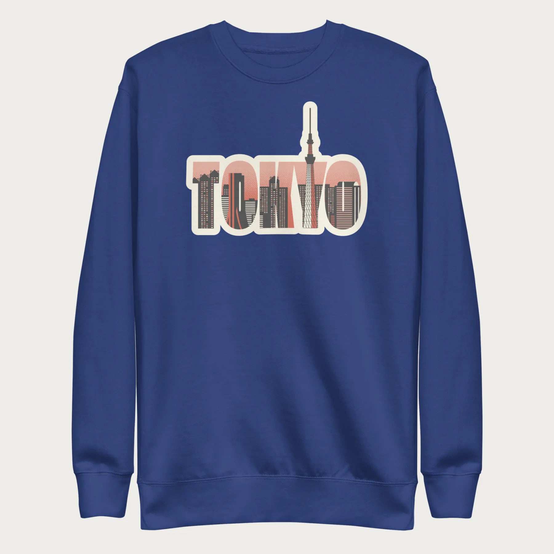 Royal blue sweatshirt with a graphic of Tokyo's skyline integrated within the letters spelling "TOKYO."