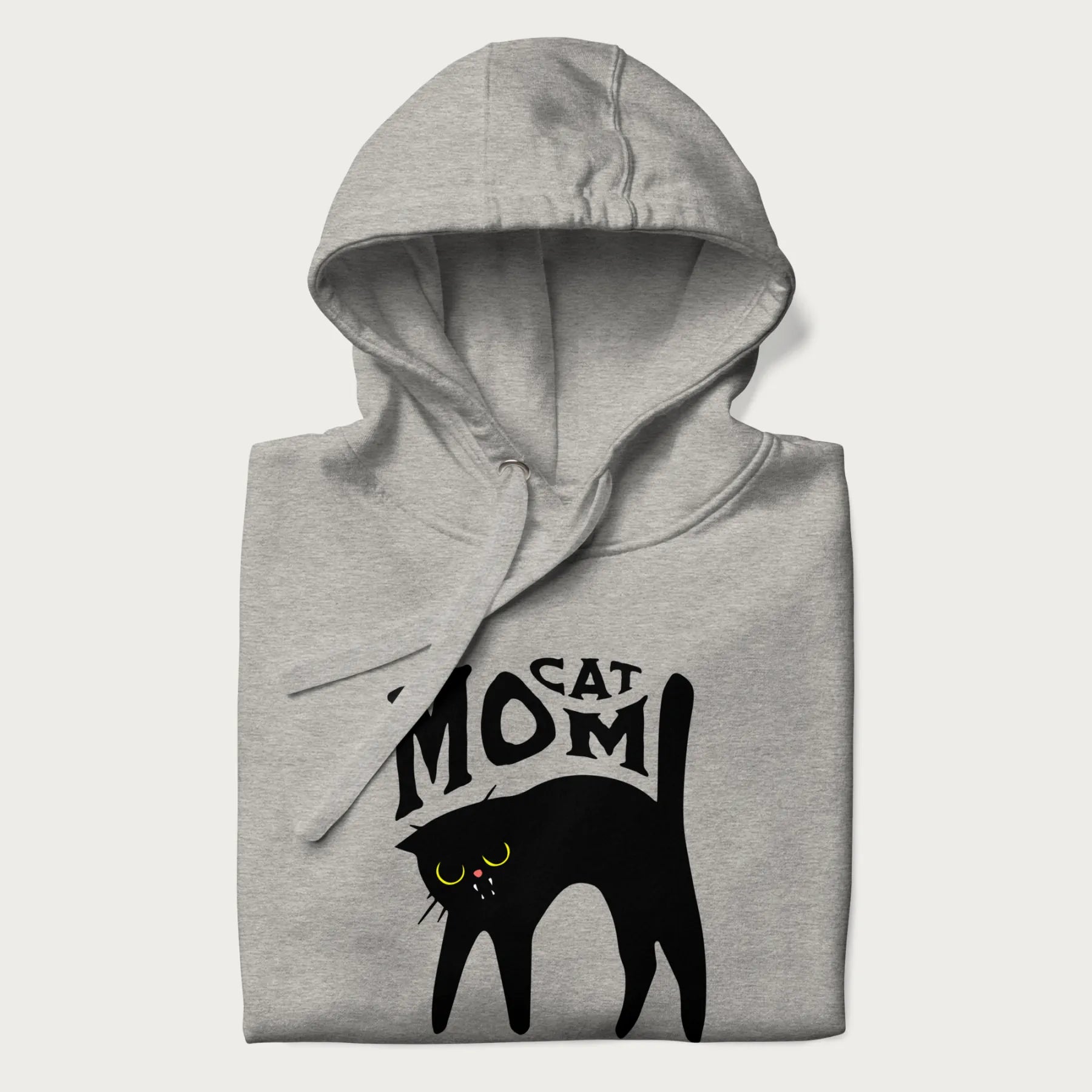 Folded light grey hoodie with 'Cat Mom' in black lettering above a minimalistic graphic of a black cat with yellow eyes.