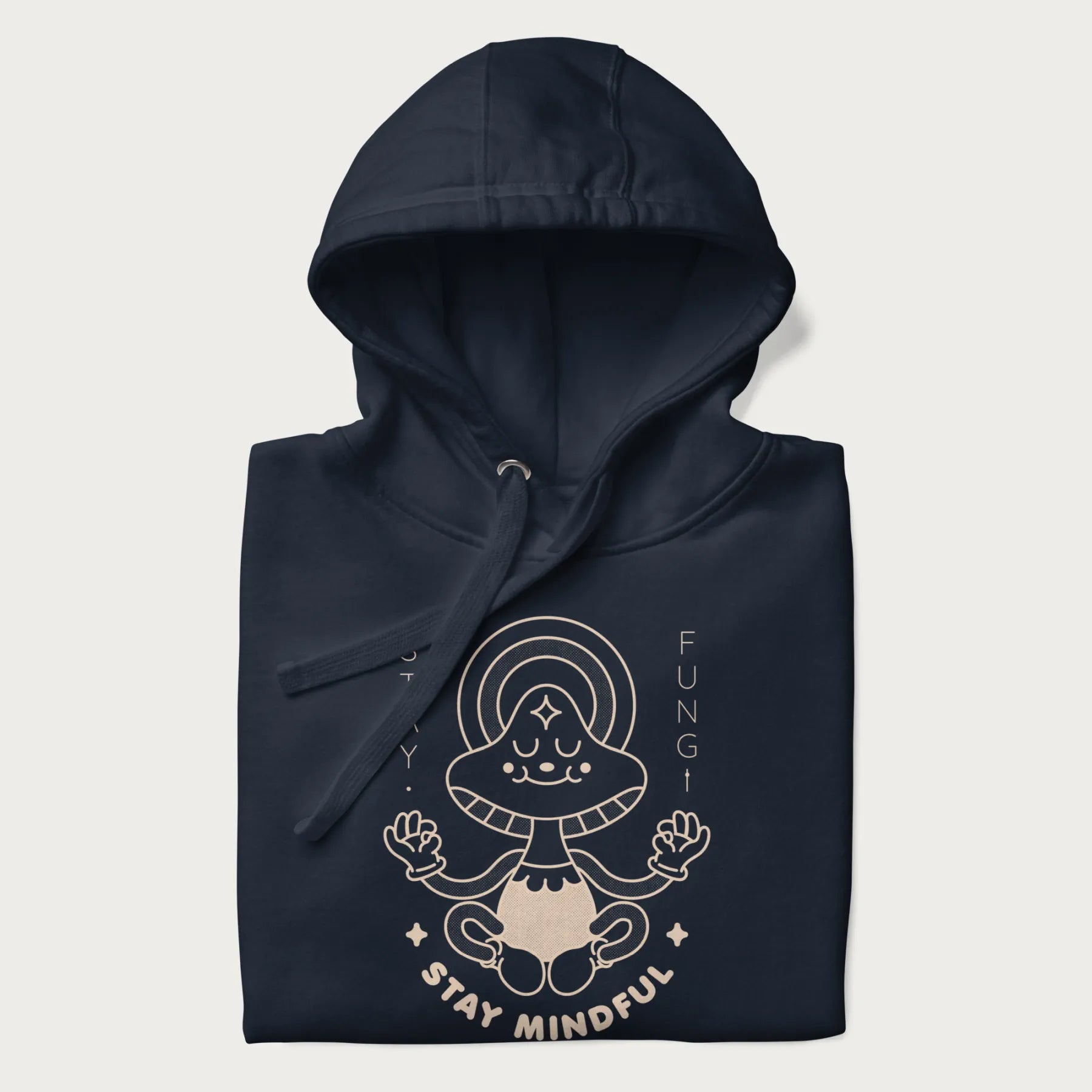 Folded navy blue hoodie with a graphic of a meditating mushroom character and the words 'Stay Fungi' and 'Stay Mindful'.