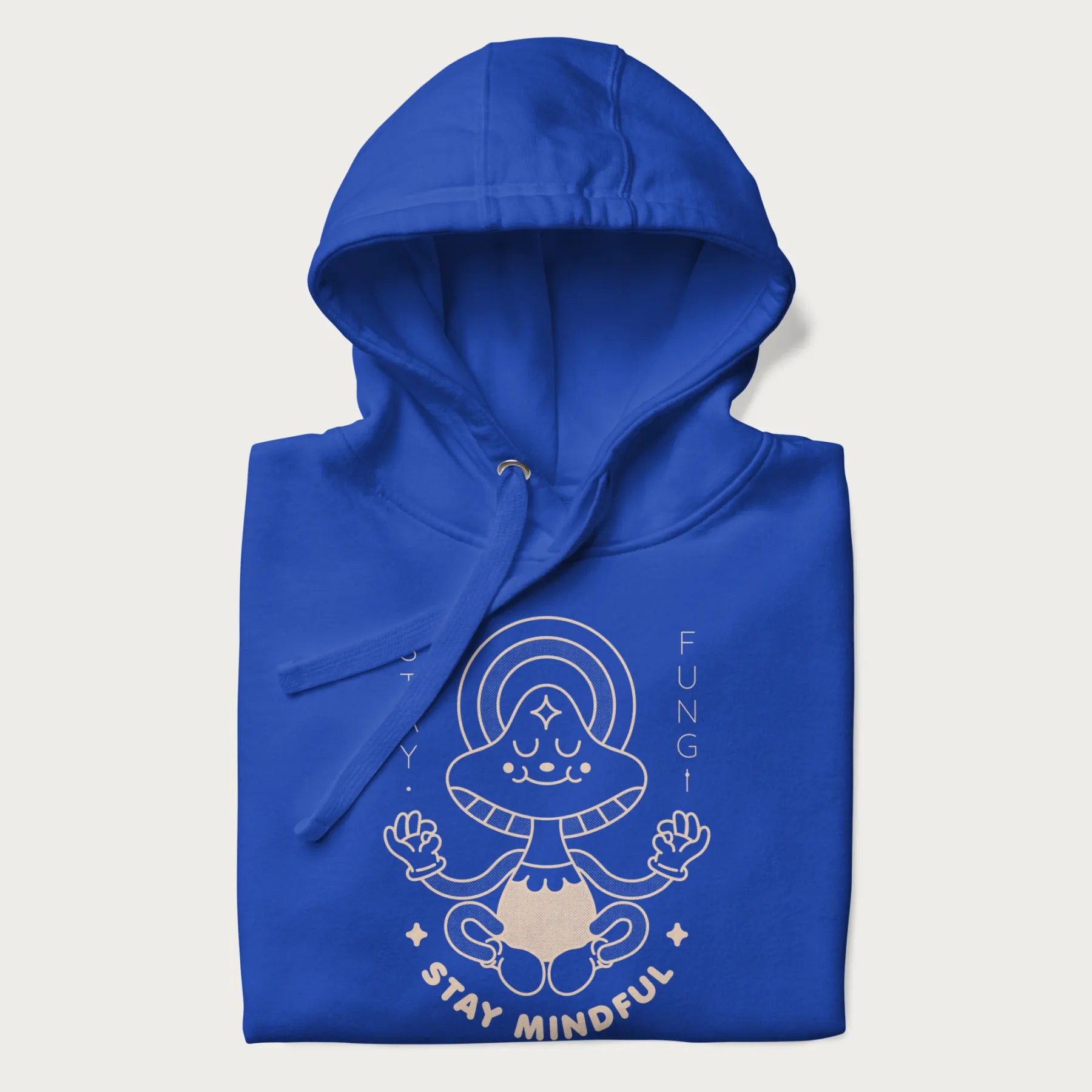 Folded royal blue hoodie with a graphic of a meditating mushroom character and the words 'Stay Fungi' and 'Stay Mindful'.